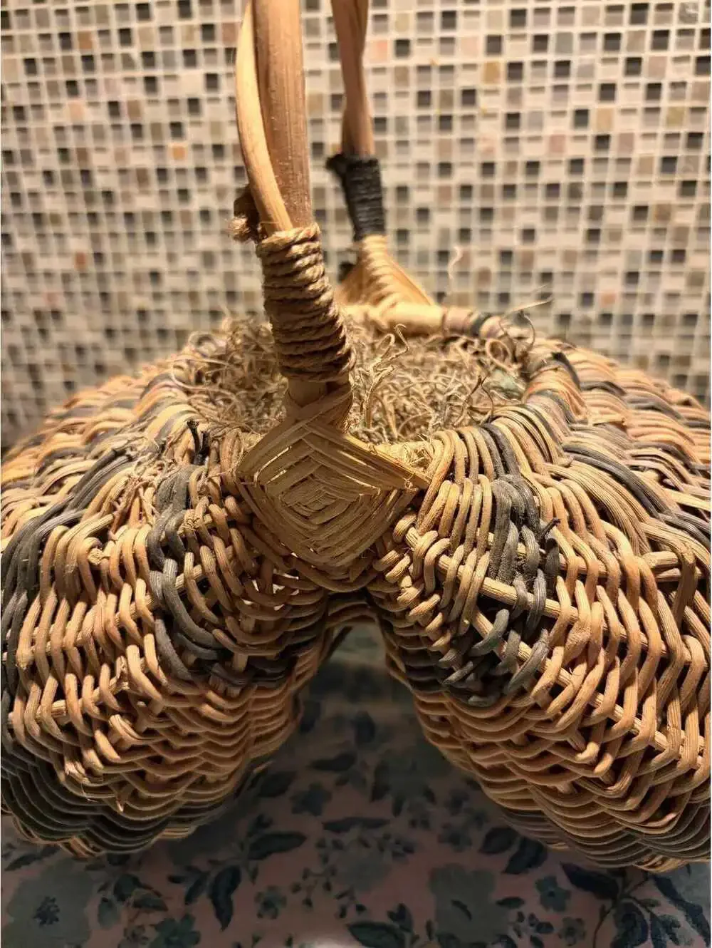 This is a vintage hand-woven double buttocks wicker harvest basket.